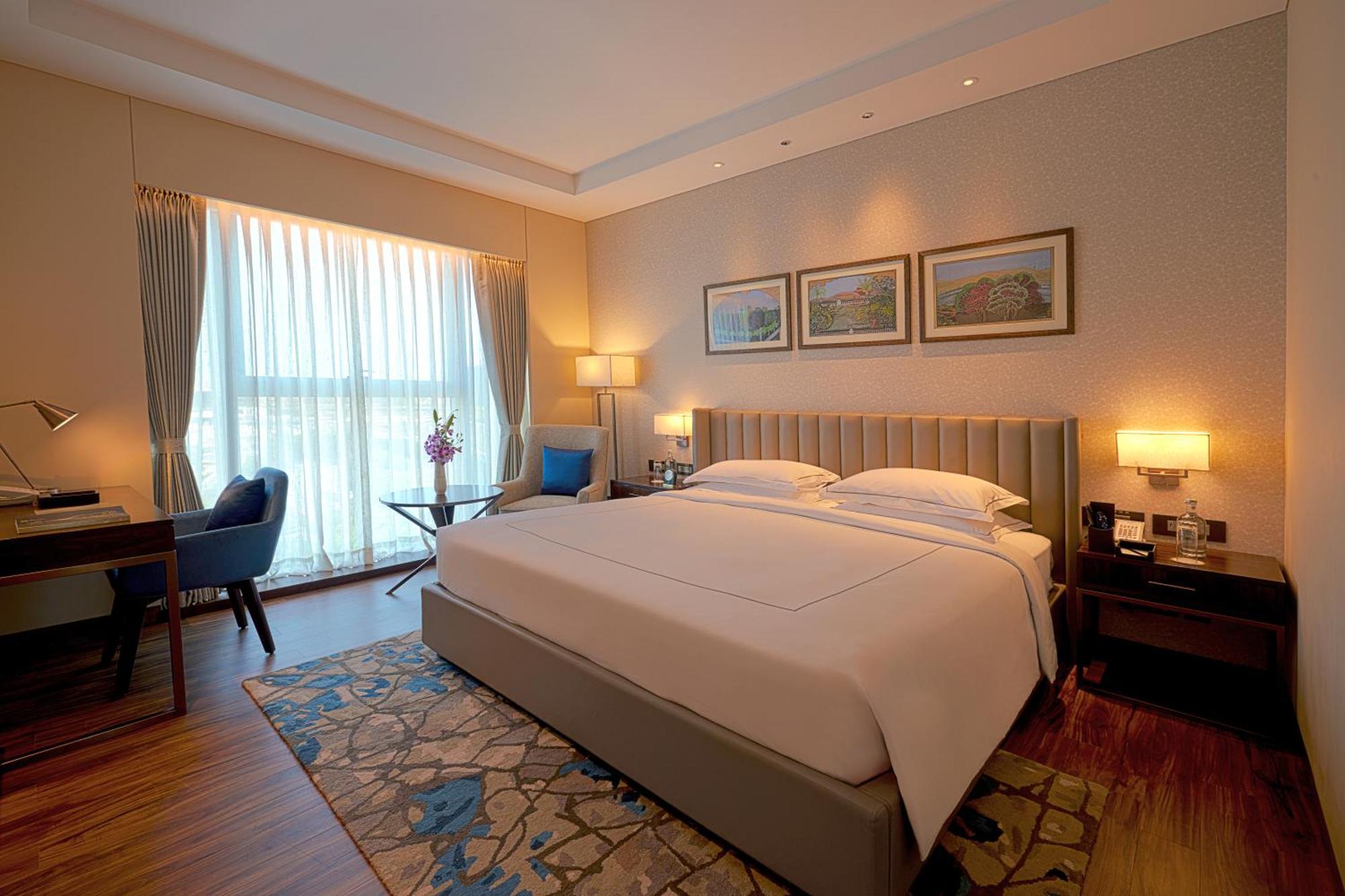 Taj Bangalore Devanahalli Ngoại thất bức ảnh A bedroom at the Taj Bengal